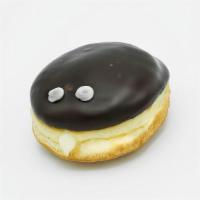 Vegan Portland Cream · Vegan raised yeast shell filled with Bavarian cream and topped with chocolate and two eyebal...