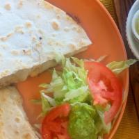 Quesadilla · Texas sized quesadilla always served on double 10' Flour Tortillas packed with Monterrey che...