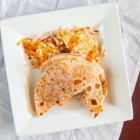 Breakfast Tacos · Two flour tortillas filled with eggs, bacon. Potatoes and cheese served with golden hash bro...