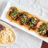 Tacos Del Pueblo · Chopped fajita beef, onions, jalapeños, and cilantro y queso fresco on a corn tortilla. Serv...
