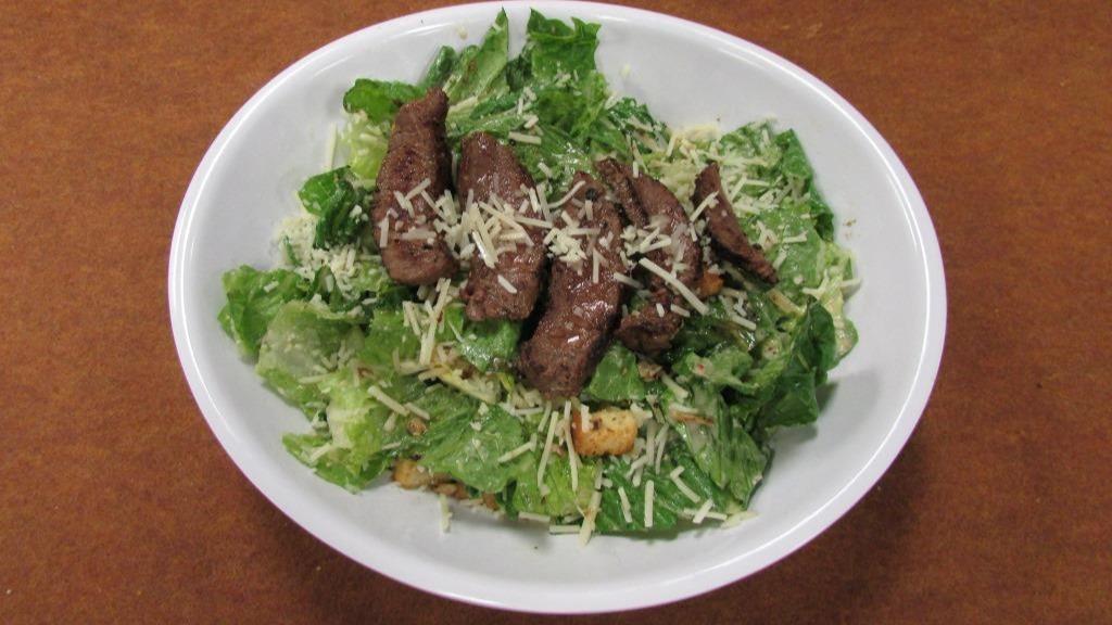 Caesar Sirloin Steak Salad · Romaine, Parmesan cheese, croutons & Caesar dressing