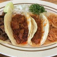 Flour Tacos · Flour tortilla, served with cilantro, onions and limes on the side. One ounce red or green s...