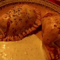 2 Empanadas · With choice of two sides.