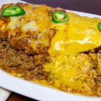 Big Juan Burrito · A massive 12 inches flour tortilla overstuffed with spicy chicken, seasoned ground beef, Mex...