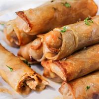 Chicken Egg Rolls (2) · Cabbage, carrots, green onions and veggies fried in a crispy wonton wrapper.