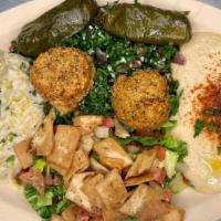 Vegetarian Mesa Platter · Hummus, baba ghanouj, fattoush, tabouleh, dolma and falafel. Served with pita bread.