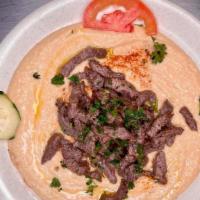 Hummus With Beef · Our large-sized hummus, topped with your choice of chicken or beef shawerma, served with pit...