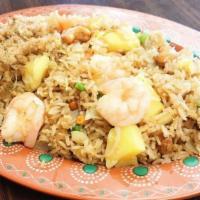 Pineapple Chicken Fried Rice · Chicken, peas, carrots, white onions, pineapple, and cashew nuts.