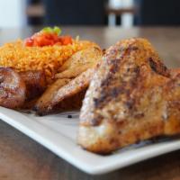 Jollof Rice + Chicken Suya Wings** · Rice made with red tomato sauce & onions and grilled chicken wings seasoned with suya spice....