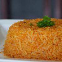 Jollof Rice · Rice mixed with red tomato sauce & onions.