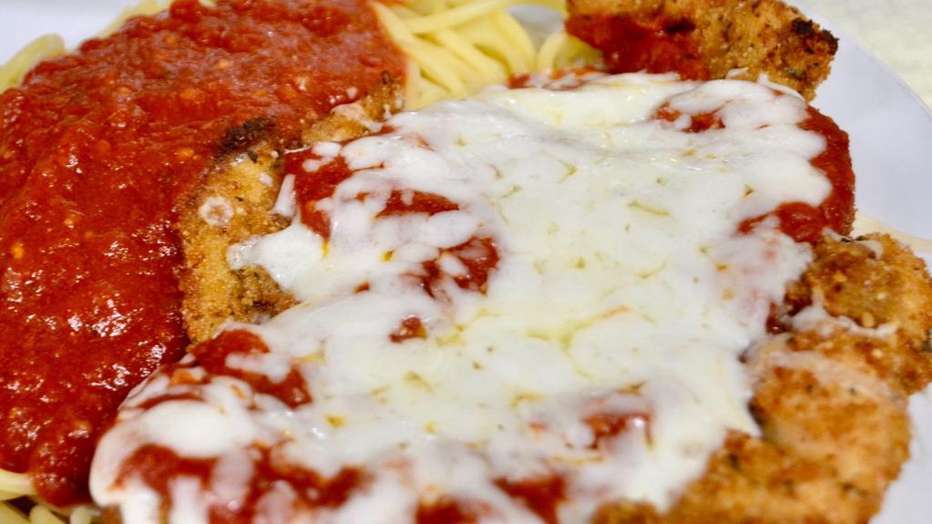 Parmigiana · Your choice of lightly hand breaded chicken or eggplant, pan fried to a golden brown, covered with homemade marinara, mozzarella cheese and baked to perfection. Served with side of spaghetti.