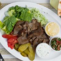 Gyro Plate · Grilled sliced beef or lamb seasoned. Served with lettuce, tomatoes, pickled cucumber, onion...