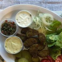 Veggie Plate · Mushroom with cheese or Falafel. Cooked on open fire. Served with hummus, tabuli and tzatzik...