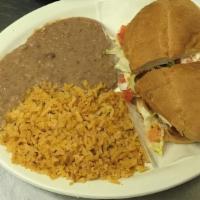 Mexican Sandwich · With your choice of meat. Served with refried beans, lettuce, tomatoes, avocado, and sour cr...