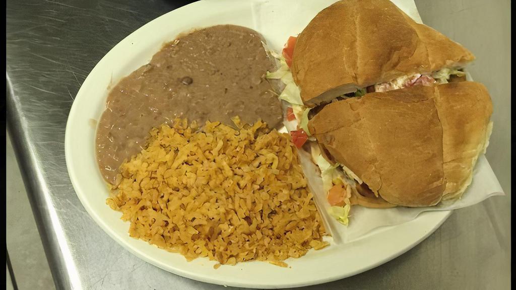 Mexican Sandwich · With your choice of meat. Served with refried beans, lettuce, tomatoes, avocado, and sour cream.