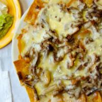 Nachos Supreme · Bean and cheese nachos with your choice of meat, topped with guacamole, sour cream, and pick...