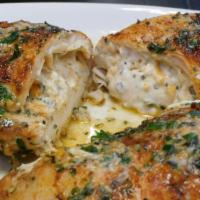 Dj'S Stuffed Chicken Breast · Our signature dish features grilled chicken breast stuffed with a creamy garlic Parmesan che...