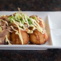 Takoyaki · These octopus dumplings are crispy on the outside, creamy on the inside. Served with katsu s...