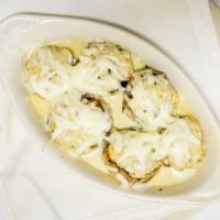Stuffed Mushroom Caps · Mushrooms stuffed with spinach, Italian cheeses and bread crumbs, topped with melted mozzare...
