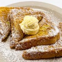 French Toast · Served with whipped butter and syrup.
