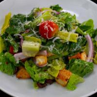 Italian Salad · Leafy romaine, red onions, cherry tomatoes, pepperoncini, olives, parmigiano, homemade seaso...
