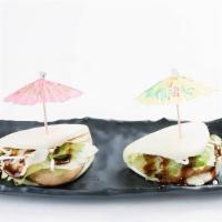 Chashu Bun (2Pcs) · Steamed buns, chashu, mayo, lettuce, sweet sauce.
