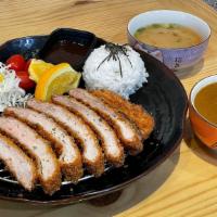 Pork Katsu Curry · Panko fried pork loin with cabbage and steamed rice.