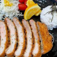 Pork Tonkatsu · Panko fried pork loin with cabbage and steamed rice.