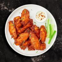 Classic Chicken Wings · Fresh chicken wings breaded and fried until golden brown. Served with a side of ranch or ble...