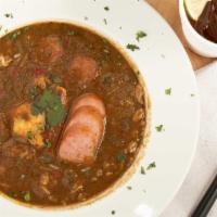 Seafood Gumbo · Cooked from scratch in our kitchens. There's Shrimp, Crab Bits, Crawfish Tails & Andouille S...