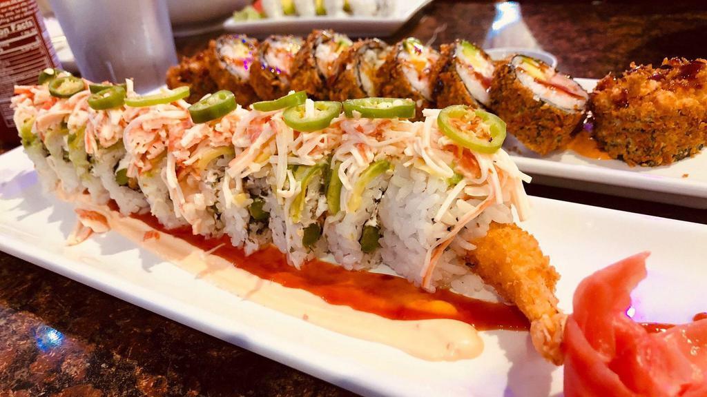 R8 Latino Roll · Tempura shrimp, cream cheese, cilantro, cucumber, topped with avocado, spicy crab, and jalepeño (spicy mayo, house chili).