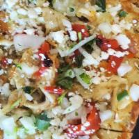 Baja Chicken Flatbread · Grilled chicken, pepper jack & Cotija cheeses, Peppadew peppers, Poblano sauce & scallions