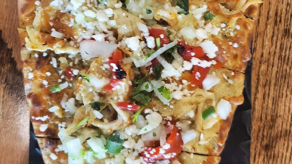 Baja Chicken Flatbread · Sliced chicken, pepper jack and cotija cheeses, fire roasted red peppers, onion and cilantro, poblano sauce and scallions. 1030 cal.