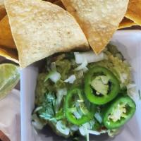 House-Made Guacamole Dips & Chips · Avocado, lime, fresh jalapeños, onion & cilantro.