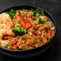 Combination Rice Bowl (Egg Roll, Grilled Pork, Grilled Shrimp) · Rice bowl with egg roll, grilled pork, and grilled shrimp.