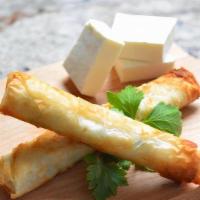 Cheese Rolls (2 Pcs) · Fillo dough rolls stuffed with Feta & Mozzarella cheese.
