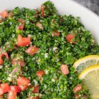 Tabouli Salad · Parsley, onions, tomatoes, cracked wheat, mint, lemon juice & olive oil.