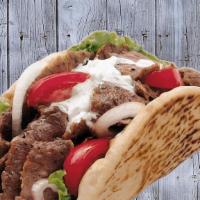 Fat Bread Gyro · Lamb & beef marinated with greek spices shaved off a rotating pit, wrapped in flatbread with...