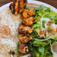 Shish Tawook · Juicy pcs of marinated grilled chicken tenders served with grilled tomato & onion. Served wi...