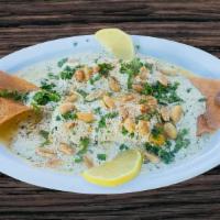 Samke Harra: Lebanese Spicy Tahini Fish · Grilled fish fillet wild salmon topped with tahini sauce, lemon, chopped parsley, garlic & p...
