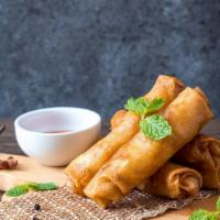 Vegetable Spring Roll · Crunchy and crispy egg roll stuffed with veggies and deep-fried to perfection.