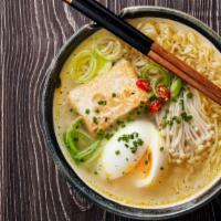 Tonkotsu Ramen · A rich flavourful intensely porky, opaque pale broth with a rich, buttery texture filled wit...