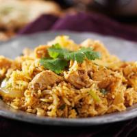 Chicken Biryani · Juicy pilao rice with spices and chicken pieces.