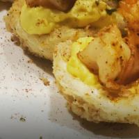 Fried Deviled Eggs · 3 fried deviled eggs topped with Cajun shrimp .
