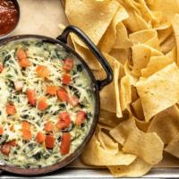 Spinach Artichoke Dip · Served with wonton chips