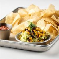 Charred Corn Guacamole · Freshmade and served with warm, homemade tortilla chips and house made salsa