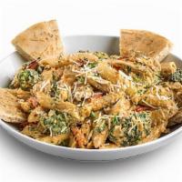 Spicy Chicken & Broccoli Penne Alfredo · Chicken, broccoli, and penne pasta tossed in a creamy Cajun alfredo sauce with roasted garli...