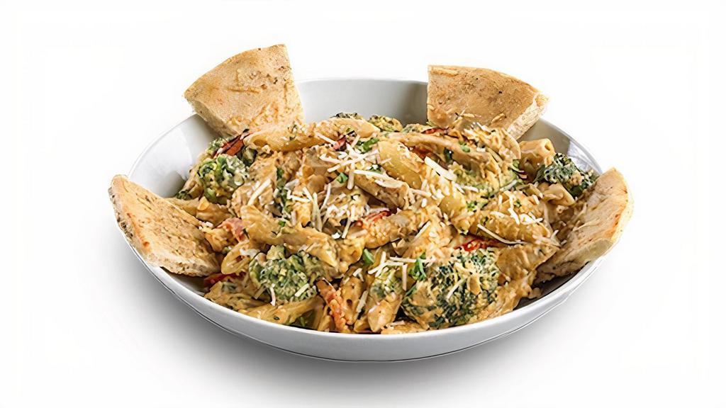 Spicy Chicken & Broccoli Penne Alfredo · Chicken, broccoli, and penne pasta tossed in a creamy Cajun alfredo sauce with roasted garlic, sun-dried tomatoes, and parmesan cheese. 2,400 Cal cal.