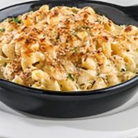 Twisted Mac & Cheese · Spiral pasta tossed in rich queso with a kick, topped with Parmesan bread crumbs and baked u...
