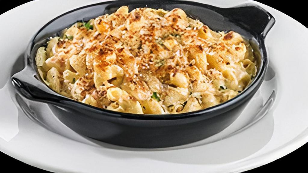 Twisted Mac & Cheese · Spiral pasta tossed in rich queso with a kick, topped with Parmesan bread crumbs and baked until golden brown. (2,040 Cal)